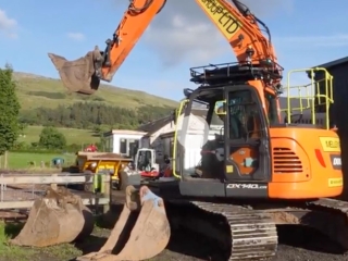A digger and bulldozer installing a new sewage treatment plant at Provanston.