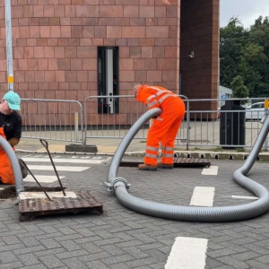 A septic tank being emptied on a main road by Septic Tank Services Ltd