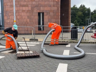 A septic tank being emptied on a main road by Septic Tank Services Ltd
