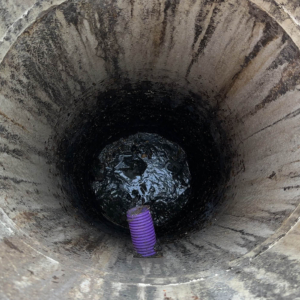A septic tank being emptied on a main road by Septic Tank Services Ltd