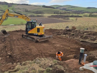 Ground works working on the soakaway during the installation of a septic tank being installed by Septic Tank Services Ltd
