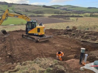 Ground works working on the soakaway during the installation of a septic tank being installed by Septic Tank Services Ltd