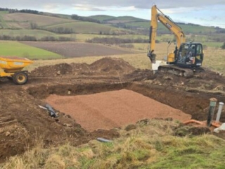 Ground works working on the soakaway during the installation of a septic tank being installed by Septic Tank Services Ltd