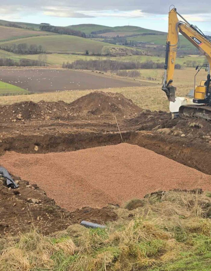 Ground works working on the soakaway during the installation of a septic tank being installed by Septic Tank Services Ltd