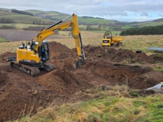 Ground works working on the soakaway during the installation of a septic tank being installed by Septic Tank Services Ltd