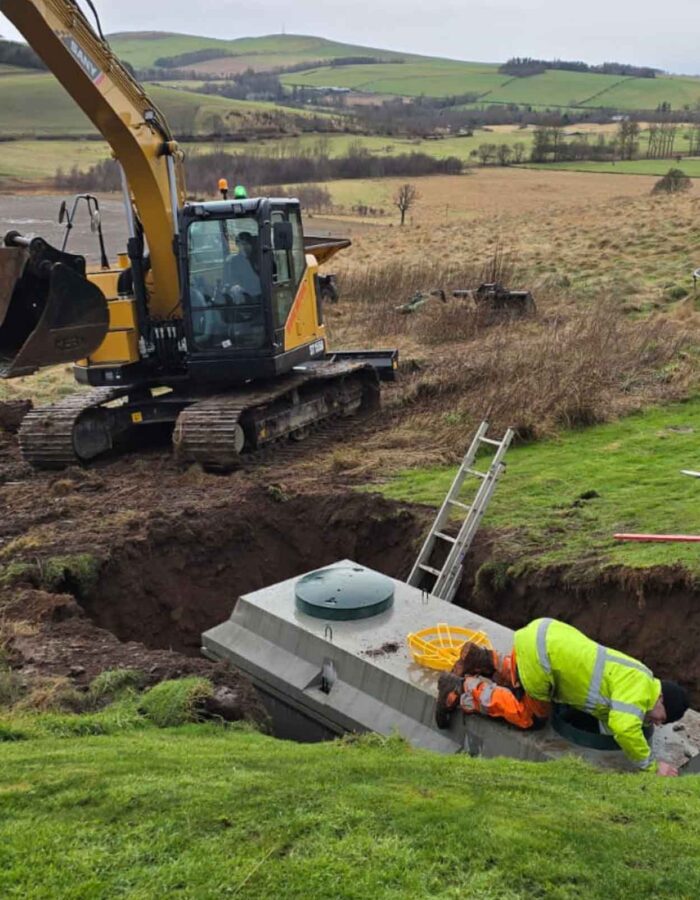 A septic tank being installed in the ground during a septic tank installation by Septic Tank Services Ltd