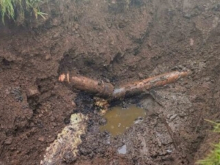 A broken septic tank pipe in the ground