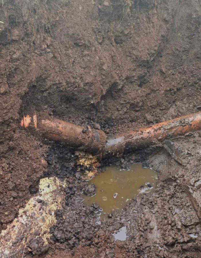 A broken septic tank pipe in the ground