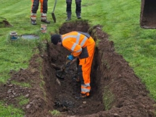 A broken septic tank pipe in the ground being worked on by Septic Tank Services Ltd