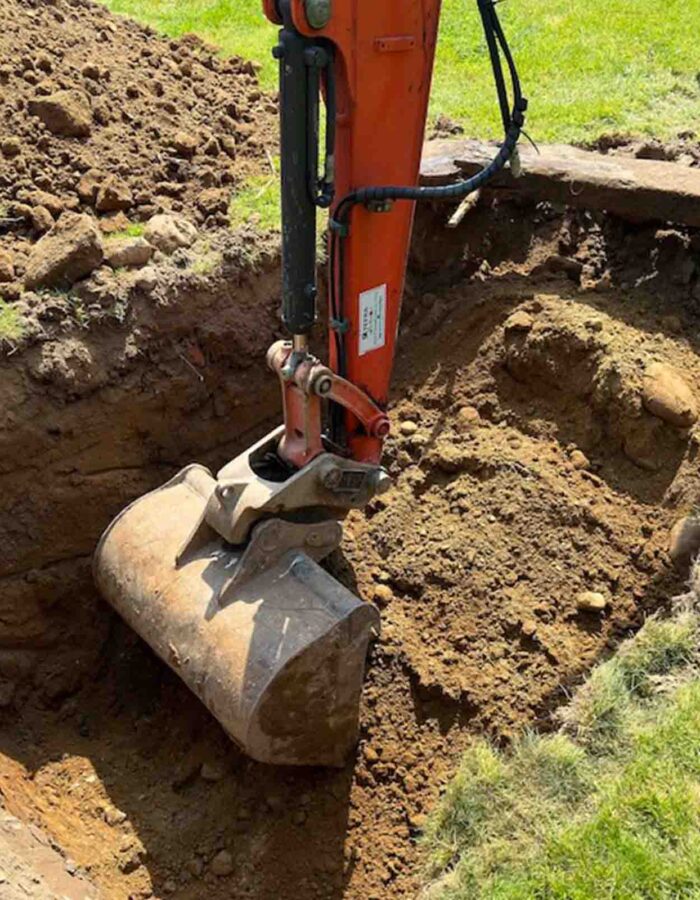 Groundworks preparing a hole to install and septic tank by Septic Tank Services Ltd