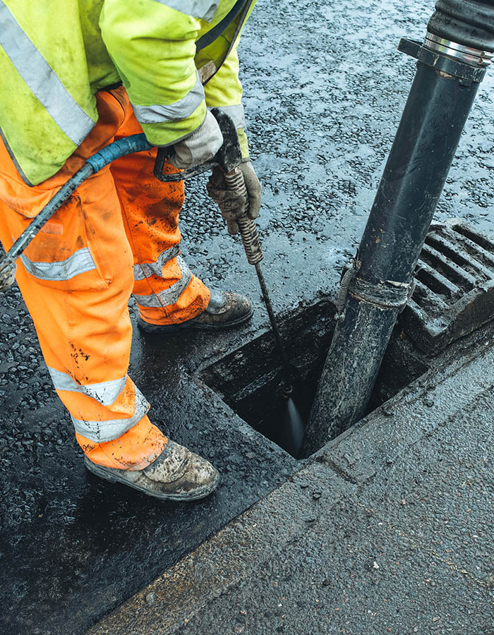 High pressure jetting a drain