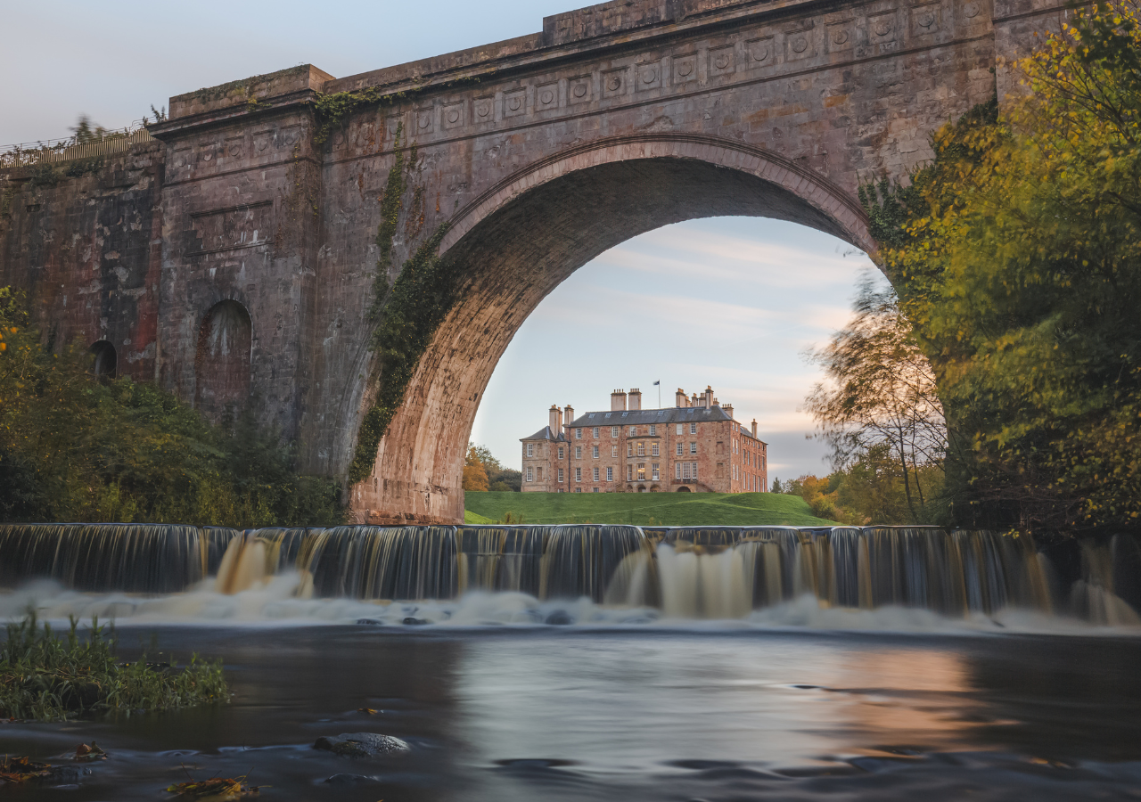 Dalkeith Country Park, with the house seen under a bridge.